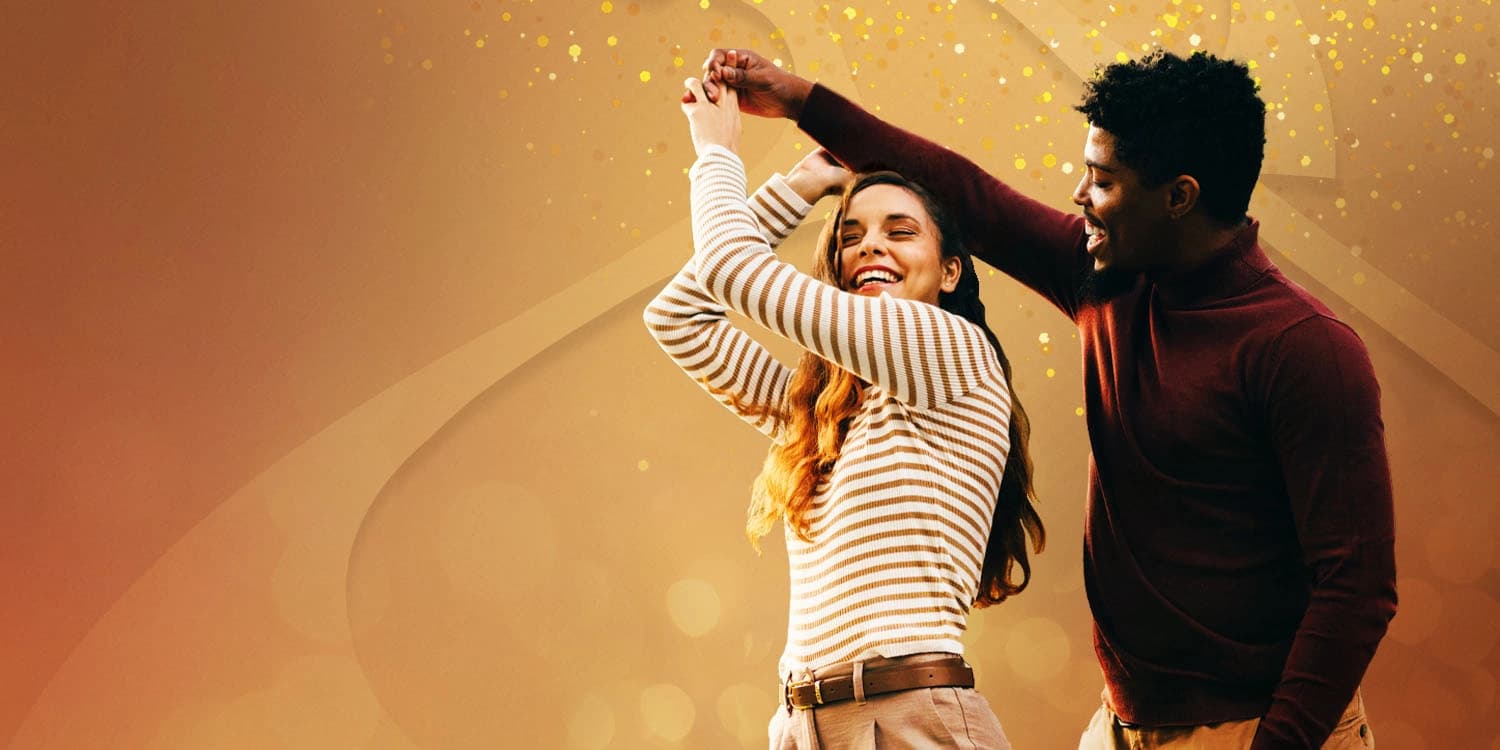Young couple dancing in the colors of Fall